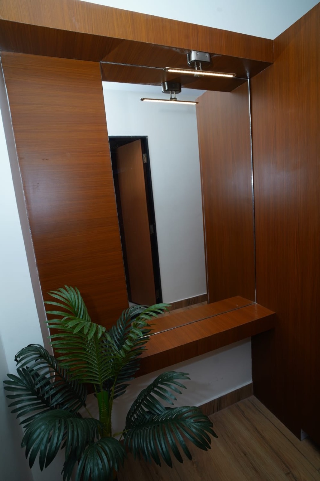 Clean modern attached bathroom at Hotel Veda Inn