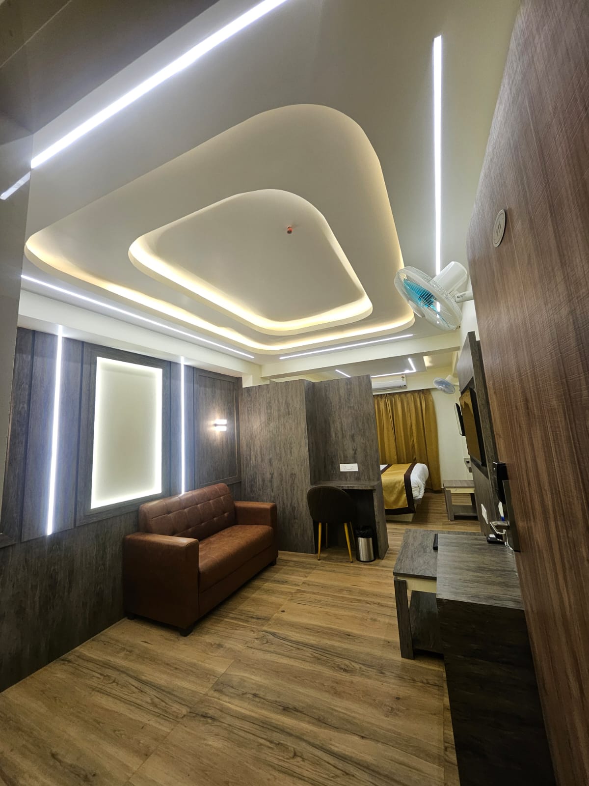 Warmly lit lounge interior of Hotel Veda Inn