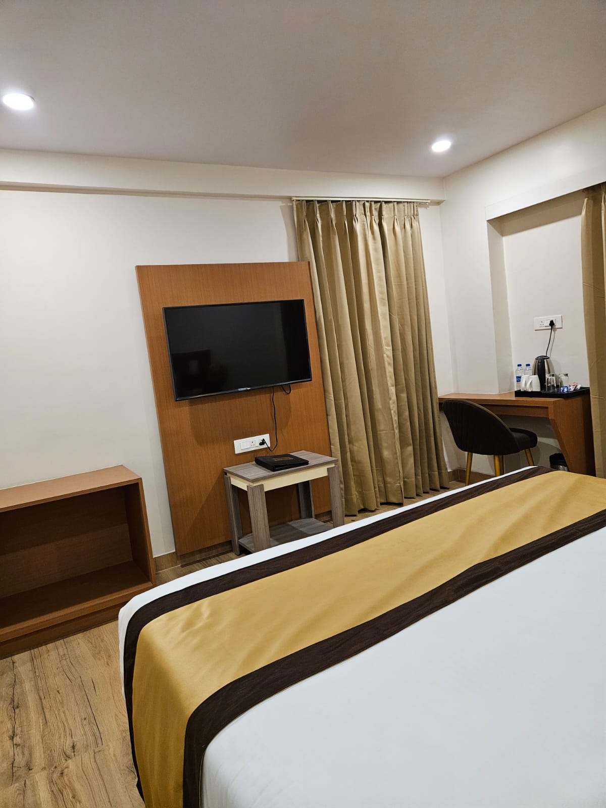 Family Suite at Hotel Veda Inn with generous beds for five guests
