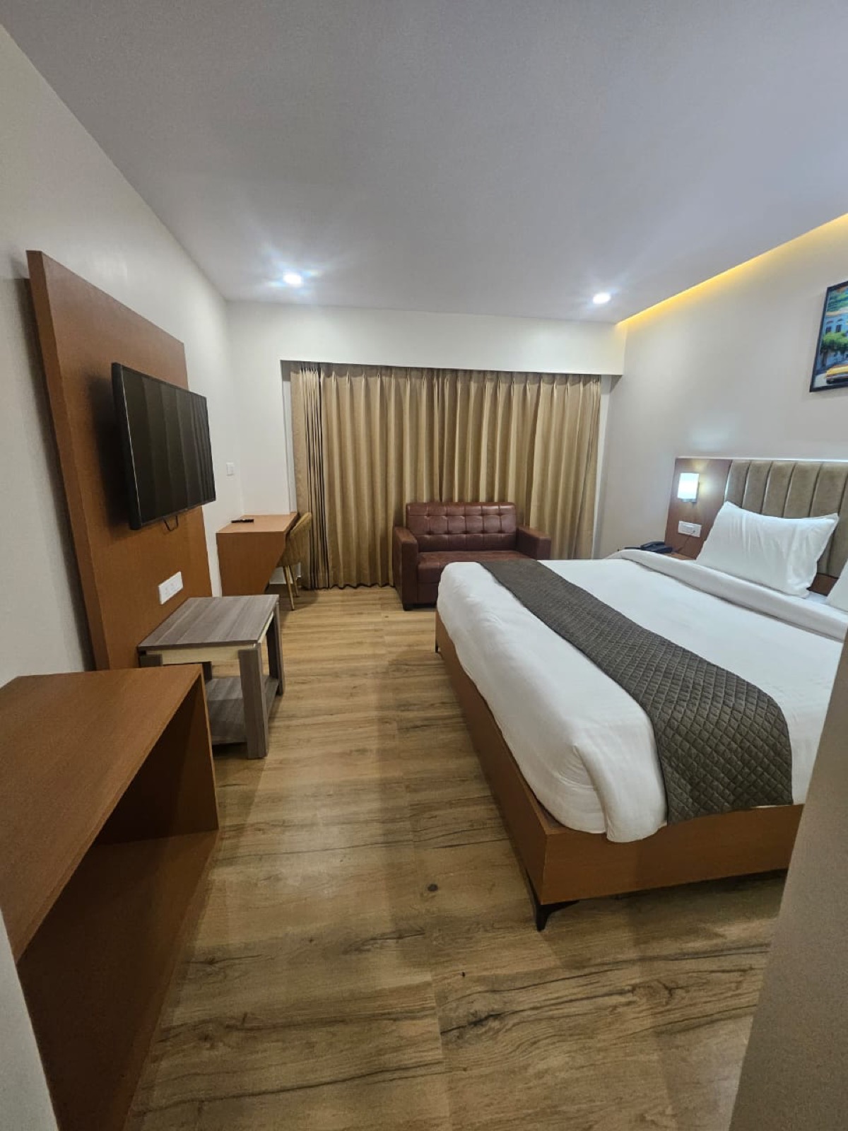 Spacious room interior at Hotel Veda Inn