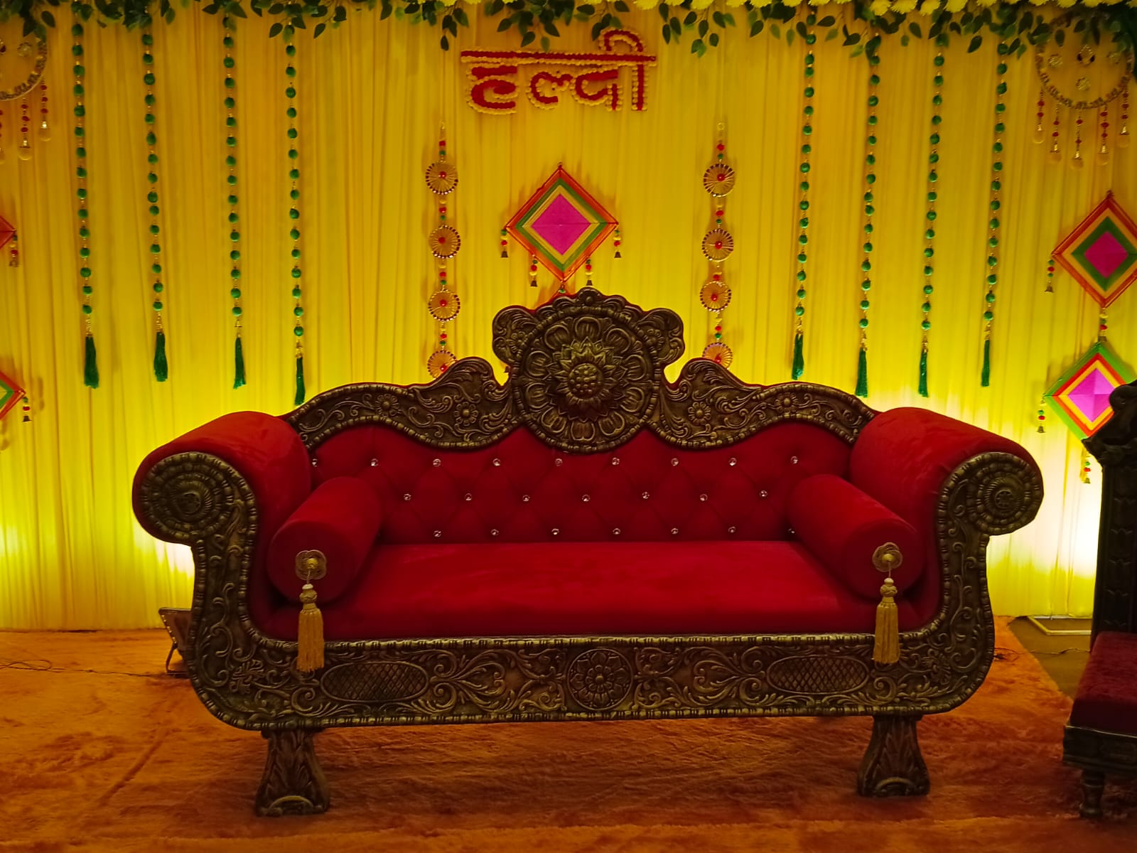 Bride and groom stage beautifully decorated for a wedding at Hotel Veda Inn